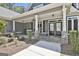 Inviting front porch with stone accents and covered entryway at 120 Laurel Forest Dr, Tyrone, GA 30290