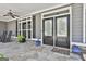 Charming front porch with double door entry and tiled flooring at 120 Laurel Forest Dr, Tyrone, GA 30290