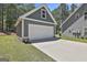 Close up of detached garage with large concrete driveway at 120 Laurel Forest Dr, Tyrone, GA 30290