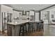Kitchen features granite countertops, stainless steel appliances, white cabinets and island seating at 120 Laurel Forest Dr, Tyrone, GA 30290