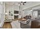 The living room is bright with a stone fireplace and lots of natural light at 120 Laurel Forest Dr, Tyrone, GA 30290