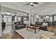 Spacious living room featuring hardwood floors, high ceilings, and an open layout at 120 Laurel Forest Dr, Tyrone, GA 30290