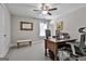 Office room with a wooden desk, plush carpet, a ceiling fan, and plenty of natural light at 120 Laurel Forest Dr, Tyrone, GA 30290