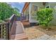 Deck and ramp leading to a beautiful backyard surrounded by mature trees at 411 Baneberry Bnd, Peachtree City, GA 30269