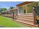 Multi-level deck and stairs, offering seamless access to the backyard and patio at 411 Baneberry Bnd, Peachtree City, GA 30269