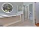 This bathroom features a large tub with a window and a separate shower at 411 Baneberry Bnd, Peachtree City, GA 30269