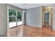 Bright dining area featuring sliding glass doors to a wooden deck, perfect for indoor-outdoor living and entertaining at 411 Baneberry Bnd, Peachtree City, GA 30269