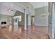 Bright and airy living room featuring hardwood floors, a fireplace, and a vaulted ceiling at 411 Baneberry Bnd, Peachtree City, GA 30269