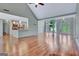 Spacious living room boasting hardwood floors, an open layout, and access to the front entrance at 411 Baneberry Bnd, Peachtree City, GA 30269