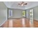 This main bedroom offers lots of natural light with two windows and trey ceilings with a ceiling fan at 411 Baneberry Bnd, Peachtree City, GA 30269