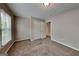 Bedroom featuring neutral paint, carpet, a window, and double closets with white doors at 1311 Bustling Sw Ln, Marietta, GA 30064
