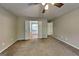 Bedroom featuring double doors leading to the ensuite bathroom and plush carpeting at 1311 Bustling Sw Ln, Marietta, GA 30064