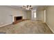 Spacious living room with neutral walls, carpet, brick fireplace and a ceiling fan at 1311 Bustling Sw Ln, Marietta, GA 30064