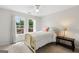 Bright bedroom with two windows providing natural light and a cozy atmosphere at 115 Roscommon Ct, Tyrone, GA 30290