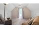 Bonus room featuring a comfy seating area and bright window with natural light at 115 Roscommon Ct, Tyrone, GA 30290