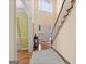 Inviting foyer with hardwood floors, staircase, and ample natural light at 115 Roscommon Ct, Tyrone, GA 30290