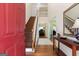 Welcoming foyer featuring hardwood floors, staircase, and an open view to the living spaces at 115 Roscommon Ct, Tyrone, GA 30290