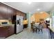 Kitchen with stainless steel refrigerator, granite counters, and eat-in dining table at 115 Roscommon Ct, Tyrone, GA 30290