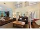 Bright living room featuring soaring ceilings, hardwood floors, and ample natural light at 115 Roscommon Ct, Tyrone, GA 30290
