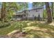 The rear exterior of the house shows a spacious backyard perfect for outdoor activities at 886 Pine Needle Rd, Hampton, GA 30228