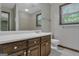 Bathroom featuring floral wallpaper and a large vanity with a large mirror at 886 Pine Needle Rd, Hampton, GA 30228