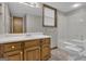 Cozy bathroom featuring a single sink vanity, toilet with rails, and shower-tub combination at 886 Pine Needle Rd, Hampton, GA 30228