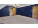 Bedroom featuring navy blue walls and white ceilings, with moon decals, and an entry to another room at 886 Pine Needle Rd, Hampton, GA 30228