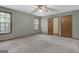 Inviting bedroom features plush carpet, natural light, and ample closet space at 886 Pine Needle Rd, Hampton, GA 30228