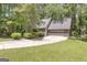 A beautiful property showcases a spacious driveway leading to a two-car garage at 886 Pine Needle Rd, Hampton, GA 30228