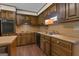 Galley kitchen with wood cabinets and countertops, and stainless steel sink at 886 Pine Needle Rd, Hampton, GA 30228