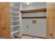 Functional laundry room with built-in shelving for organized storage solutions at 886 Pine Needle Rd, Hampton, GA 30228