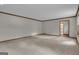 Large living room with neutral carpet is bright and spacious at 886 Pine Needle Rd, Hampton, GA 30228