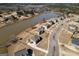 Aerial view of homes in a lakeside community with lush surroundings and a large lake at 162 Aylesbury Blvd, Mcdonough, GA 30252