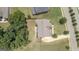 An overhead view of a spacious home and backyard with mature trees and a well-maintained lawn at 162 Aylesbury Blvd, Mcdonough, GA 30252