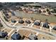 An aerial view showcases upscale homes on expansive lots near a serene lake community at 162 Aylesbury Blvd, Mcdonough, GA 30252