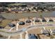 An aerial view of waterfront homes with manicured lawns situated along a tranquil lake at 162 Aylesbury Blvd, Mcdonough, GA 30252
