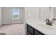 Bathroom with white sink and bronze faucet, next to bedroom at 162 Aylesbury Blvd, Mcdonough, GA 30252