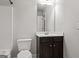 Bathroom featuring a toilet, vanity with a dark wood cabinet, and a shower/tub combo at 162 Aylesbury Blvd, Mcdonough, GA 30252