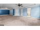 Expansive bedroom with blue accent wall, tray ceilings and multiple doorways at 162 Aylesbury Blvd, Mcdonough, GA 30252