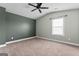 Bedroom featuring carpet and window at 162 Aylesbury Blvd, Mcdonough, GA 30252