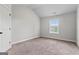 Bedroom featuring a window and sloped ceiling at 162 Aylesbury Blvd, Mcdonough, GA 30252