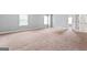 Spacious bedroom with carpet and natural light at 162 Aylesbury Blvd, Mcdonough, GA 30252