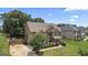 Aerial view of a brick two-story home with manicured lawn and driveway at 162 Aylesbury Blvd, Mcdonough, GA 30252