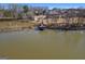 A dock stretches out into the lake offering serene views of the water and surrounding neighborhood at 162 Aylesbury Blvd, Mcdonough, GA 30252