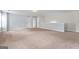 Large open loft space with neutral color walls and carpet at 162 Aylesbury Blvd, Mcdonough, GA 30252