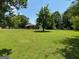 Expansive backyard, showcasing the mature trees, open space, and the potential for outdoor activities at 18 North Ave, Hampton, GA 30228