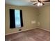 Cozy bedroom featuring a bright window and neutral colors at 18 North Ave, Hampton, GA 30228