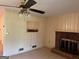 Inviting living room with fireplace and ceiling fan at 18 North Ave, Hampton, GA 30228