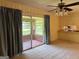 Spacious living area leads to a bright sunroom with brick accents at 18 North Ave, Hampton, GA 30228