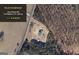 Aerial view of a property outlined in yellow on 2 acres in a wooded area at 1621 Dixie Rd, Covington, GA 30014
